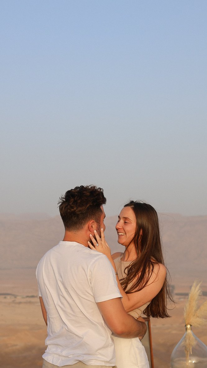 Gabriella and Joshua laughing in the desert
