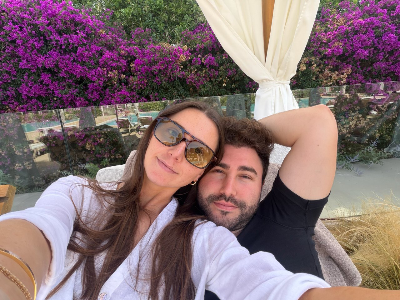 A selfie beneath pink bougainvillea